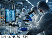 Two Scientists In Sterile Suites At Research Factory: Engineer Using Microscope And Desktop Computer To Inspect Microchip. Стоковое AI-изображение, AI-художник Sergey Grishin / Фотобанк Лори