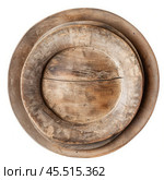 Three nested rustic wooden plates displaying their grain and imperfections. Стоковое AI-изображение, AI-художник Иван Рябоконь / Фотобанк Лори