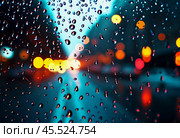 Raindrops cling to the surface of car glass, distorting a vibrant cityscape at evening, where colorful lights from traffic and buildings merge into a beautiful display. Generative AI. Стоковое AI-изображение, AI-художник Юлия Петровская / Фотобанк Лори
