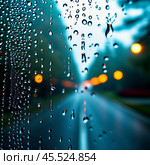 Raindrops cling to the surface of car glass, distorting a vibrant cityscape at evening, where colorful lights from traffic and buildings merge into a beautiful display. Generative AI. Стоковое AI-изображение, AI-художник Юлия Петровская / Фотобанк Лори