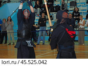 Nizhny Novgorod, Russia, 11.24.2024 Gagarin Avenue 25 d Russian Kendo Championship. Athletes in protective equipment with a sword and a protective helmet at competitions. Редакционное фото, фотограф Egor Sarantstv / Фотобанк Лори