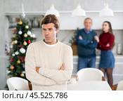 Domestic quarrel during Christmas celebration. Man does not want to talk because of disagreements with his father and wife. Стоковое фото, фотограф Яков Филимонов / Фотобанк Лори