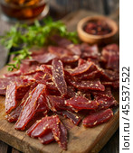 Every year on November 27th, Dried Meat Day is celebrated. The holiday is dedicated to homemade dried meat and simple recipes, the best from generation to generation. Стоковое AI-изображение, AI-художник Сергей Елизарьев / Фотобанк Лори