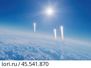 Ballistic missiles fly above the clouds, leaving contrails. Стоковое AI-изображение, AI-художник Евгений Харитонов / Фотобанк Лори