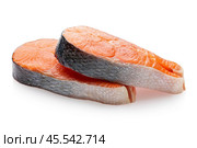 Two fresh raw salmon steaks lying on each other isolated on white background, sharpness across the entire object. Стоковое фото, фотограф Сергей Чайко / Фотобанк Лори