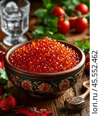 Red caviar in a wooden bowl. A beautiful and original appetizer for a festive table. Enjoy your meal! Стоковое AI-изображение, AI-художник Сергей Елизарьев / Фотобанк Лори