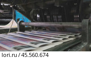 Printing house equipment in action printing and sorting newspapers. Стоковое видео, видеограф Антон Гвоздиков / Фотобанк Лори