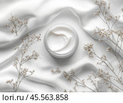 Jar of cream surrounded by white flowers and baby's breath on marble surface in a beauty and fashion setting. Стоковое AI-изображение, AI-художник Ярославский Максим / Фотобанк Лори