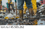 Sanitation workers cleaning a polluted landfill site with protective boots and shovels. Стоковое AI-видео, аниматор Юрий Поздников / Фотобанк Лори