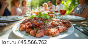 Grilled meat platter starring at a barbecue party with friends enjoying food and drinks. Стоковое AI-изображение, AI-художник Юрий Поздников / Фотобанк Лори