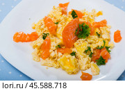 Cooked tasty omlette fried with salmon served at plate on table. Стоковое фото, фотограф Яков Филимонов / Фотобанк Лори