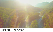 Low altitude flight over fresh fast mountain river with rocks at sunny summer morning. Стоковое видео, видеограф Александр Маркин / Фотобанк Лори