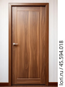 A modern walnut wooden door with a platband against white wall. Стоковое AI-изображение, AI-художник Михаил Строгалев / Фотобанк Лори