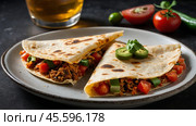 Tacos filled with savory meat and crisp vegetables rest on a rustic platter surrounded by fresh limes, tomatoes, and salsa, showcasing vibrant Mexican cuisine. Стоковое AI-изображение, AI-художник Lena Bereberdina / Фотобанк Лори