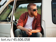 Driver sits in his truck cab. Стоковое фото, фотограф Дмитрий Киселёв / Фотобанк Лори