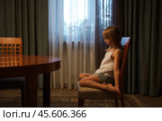 Offended girl sitting on a chair. Стоковое фото, фотограф Дмитрий Киселёв / Фотобанк Лори