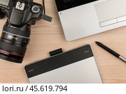 Working table of photographer or artist overhead view. Стоковое фото, фотограф Александр Собко / Фотобанк Лори