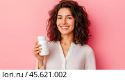 The girl advertises Biologically active additives, medicines. A white jar is in the young woman's hand. Стоковое AI-изображение, AI-художник Ирина Ручушкина / Фотобанк Лори