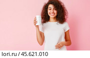 The girl advertises Biologically active additives, medicines. A white jar is in the young woman's hand. Стоковое AI-изображение, AI-художник Ирина Ручушкина / Фотобанк Лори