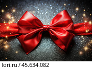 Elegant bow made of satin red ribbon on a shiny black background. Стоковое AI-изображение, AI-художник Photojuli / Фотобанк Лори