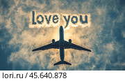 Romantic message in the sky during Valentine's Day with an airplane flying over. Стоковое AI-изображение, AI-художник Елена Зубкова / Фотобанк Лори