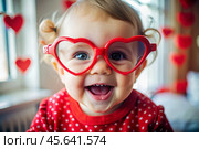 A cute little girl in stylish red heart-shaped glasses, having fun celebrating Valentine's Day. Стоковое AI-изображение, AI-художник Photojuli / Фотобанк Лори