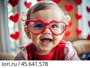A cute little girl in stylish red heart-shaped glasses, having fun celebrating Valentine's Day. Стоковое AI-изображение, AI-художник Photojuli / Фотобанк Лори