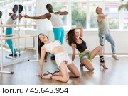 Female dancer performing contemporary sass dance floorwork in studio. Стоковое фото, фотограф Яков Филимонов / Фотобанк Лори