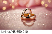 Gold wedding rings on a pink background with a side. Wedding rings. The wedding day. The newlyweds. Стоковое AI-изображение, AI-художник Photojuli / Фотобанк Лори