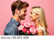 A European guy with a model appearance gives a bouquet of flowers to a European girl, blonde hair, they look into each other's eyes with warmth and smile. Стоковое AI-изображение, AI-художник Владислав Тригуб / Фотобанк Лори