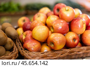 Red apple fruits are stacked in large and capacious boxes. Стоковое фото, фотограф Яков Филимонов / Фотобанк Лори