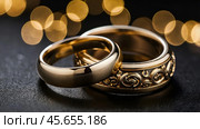 Gold wedding rings on a black background with a side. Wedding rings. The wedding day. The newlyweds. Стоковое AI-изображение, AI-художник Photojuli / Фотобанк Лори