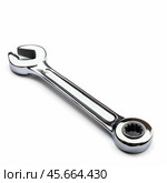 Chrome ratcheting combination wrench lying on white background. Стоковое AI-изображение, AI-художник Иван Рябоконь / Фотобанк Лори
