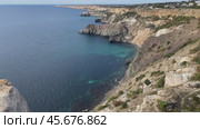Cliffs Coastline Crimea: Aerial view showcasing scenic coastal landscape, highlighting geological formations and turquoise waters. Стоковое видео, видеограф svetograph / Фотобанк Лори
