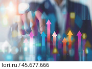 Increased profits. Benchmarking. Businessman analyzes profitability of working companies with digital augmented reality graphics, positive indicators, growing up graph and charts, colorful arrows. Стоковое AI-изображение, AI-художник Марина Демидюк / Фотобанк Лори