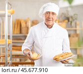 Elderly man seller with bocadillo in bakery. Стоковое фото, фотограф Яков Филимонов / Фотобанк Лори