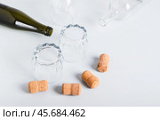 Alcoholism concept, empty glasses and bottles on grey background. Стоковое фото, фотограф Елена Руй / Фотобанк Лори