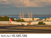 TAP Air Portugal Embraer Embraer E190LR passenger plane taxi on runway in Humberto Delgado Airport in Lisbon (2023 год). Редакционное фото, фотограф Дмитрий Рухленко / Фотобанк Лори