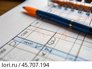 Blue pen lying on detailed handwritten music notes manuscript with red pencil corrections. Стоковое AI-изображение, AI-художник Иван Рябоконь / Фотобанк Лори