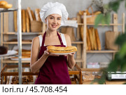 Young woman seller with bocadillo in bakery. Стоковое фото, фотограф Яков Филимонов / Фотобанк Лори