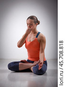 Sporty fit yogini woman practices yoga pranayama breath control. Стоковое фото, фотограф Дмитрий Рухленко / Фотобанк Лори
