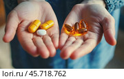 Pills on the human palms. Hands Holding Various of Dietary Supplements for Health, Wellness Support. Closeup two hands with variety of vitamins. Supplementary food, fish oil, minerals. Mental problem. Стоковое AI-видео, аниматор Марина Демидюк / Фотобанк Лори
