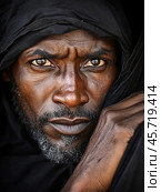 Portrait of a Black man in traditional outfit with intense gaze and deep expression. Стоковое AI-изображение, AI-художник Ксения Лаптева / Фотобанк Лори