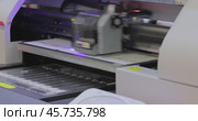 Modern Digital Large format UV printer. Printing production technologies. UV pinning is the process of applying a dose of low intensity ultraviolet light to a UV curable ink. Стоковое видео, видеограф Андрей Армягов / Фотобанк Лори