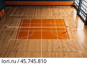 Professional volleyball courts with white lines, nobody. Crop photo of orange volleyball court in sport gym, sporty backdrop. Team game success, healthy sporty lifestyle concept. Copy ad text space. Стоковое AI-изображение, AI-художник Aleksandr Golubev / Фотобанк Лори
