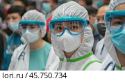 Medical health workers in protective suit, mask, gloves, goggles, face shield. Virus prevention equipment. PPE personal protection. Precaution measures. CDC staff. Asian doctors in PPE biohazard gear. Стоковое AI-видео, аниматор Марина Демидюк / Фотобанк Лори