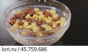 Breakfast Chocolate corn cereal in a bowl with milk. Стоковое видео, видеограф Андрей Армягов / Фотобанк Лори