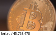 Gold Bitcoin Symbol beautifully placed on a Wooden Surface. Close up. Стоковое видео, видеограф Степанов Григорий / Фотобанк Лори