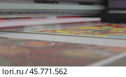 Modern Digital Large format UV printer. Printing production technologies. UV pinning is the process of applying a dose of low intensity ultraviolet light to a UV curable ink. Стоковое видео, видеограф Андрей Армягов / Фотобанк Лори