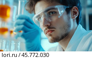 Young scientist conducts research in a laboratory, focusing on chemical experiments with glassware and bright liquids. Стоковое AI-изображение, AI-художник Сергей Толмачёв / Фотобанк Лори